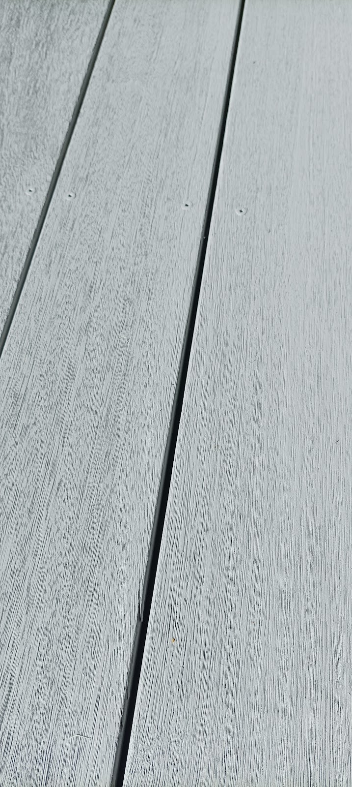 Close-up of new grey composite decking boards